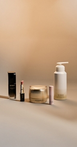 Must-haves for the holiday season next to each other on neutral surface with festive background